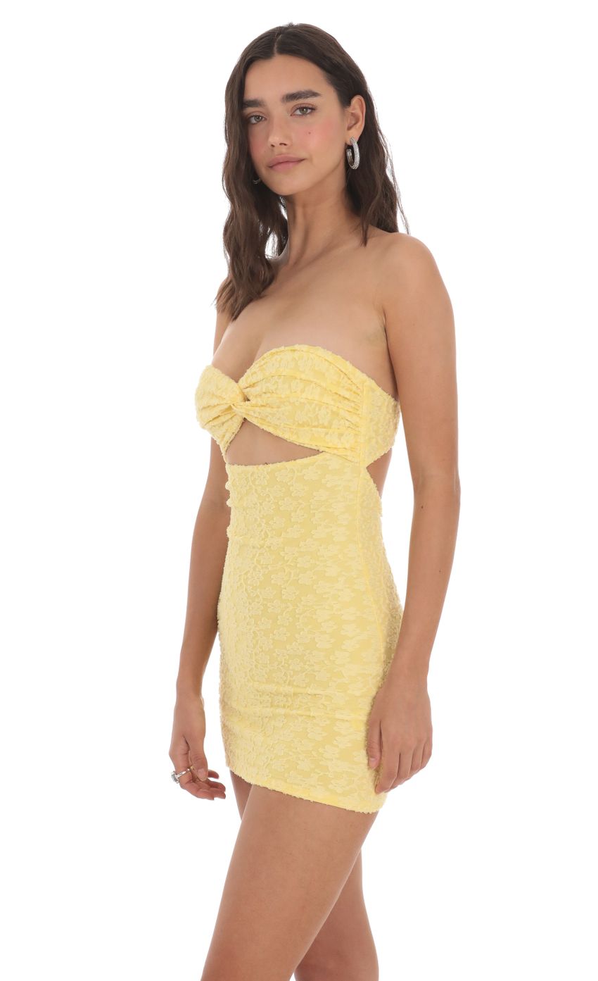 Picture Textured Floral Cutout Dress in Yellow. Source: https://media-img.lucyinthesky.com/data/May24/850xAUTO/a2251646-047c-4c52-85da-fd0ed1743bd6.jpg