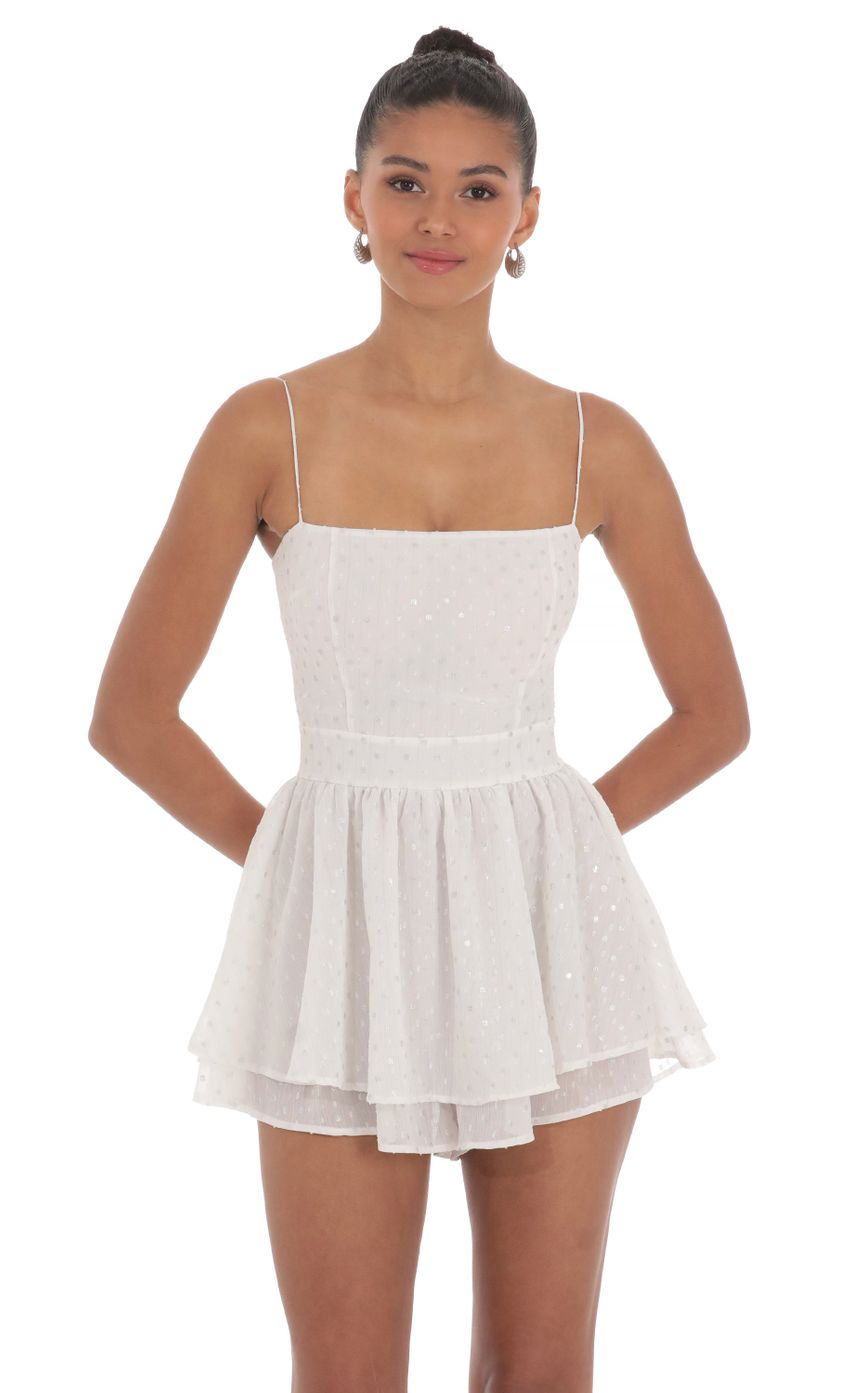Picture Shimmer Dotted Double Ruffle Romper in White. Source: https://media-img.lucyinthesky.com/data/May24/850xAUTO/b3dd24e4-d854-4d8b-9276-4079c8dba5ca.jpg