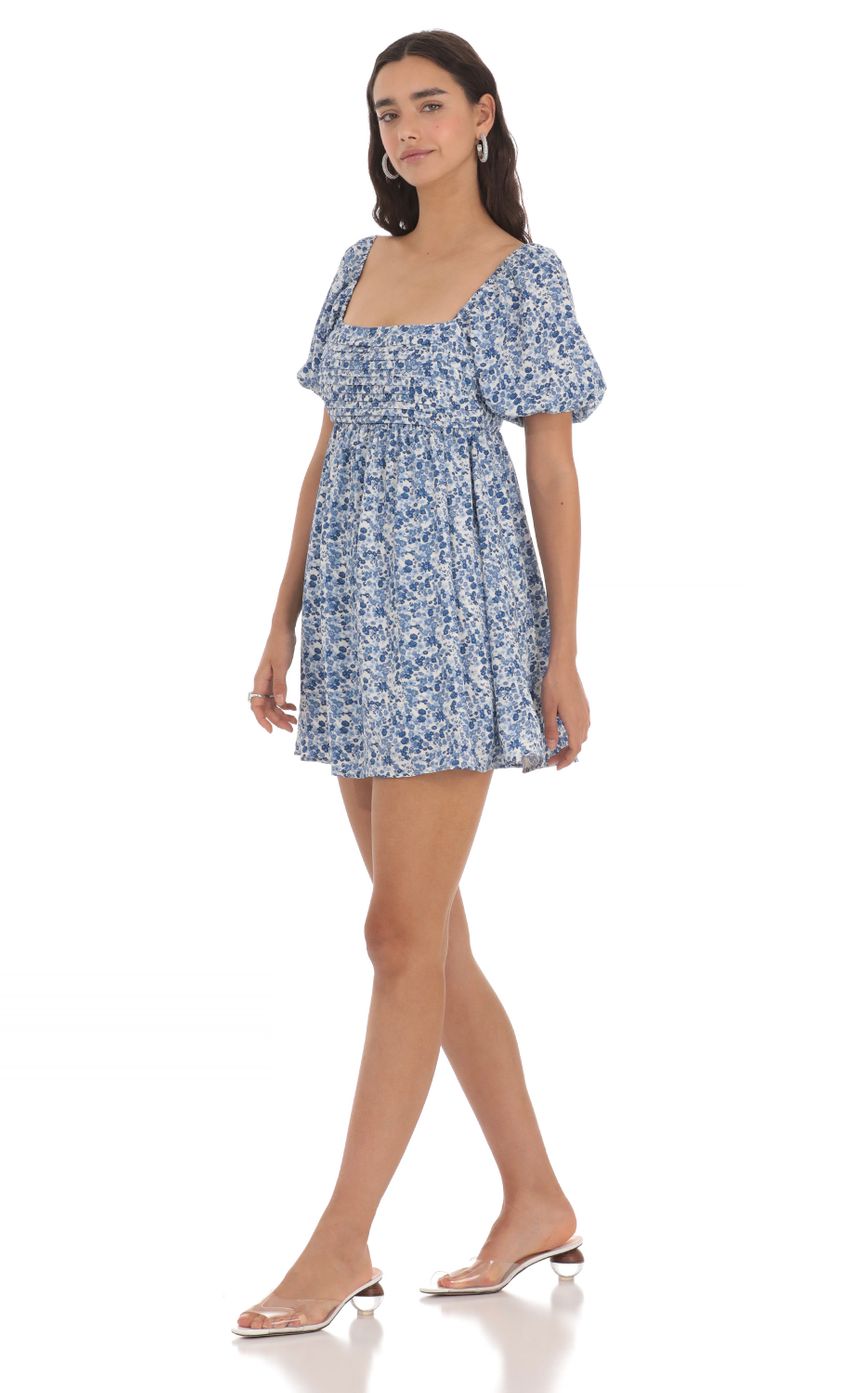 Picture Floral Puff Sleeve Dress in Blue. Source: https://media-img.lucyinthesky.com/data/May24/850xAUTO/b63ab864-fdec-4add-a0fe-2c63ee0fd606.jpg