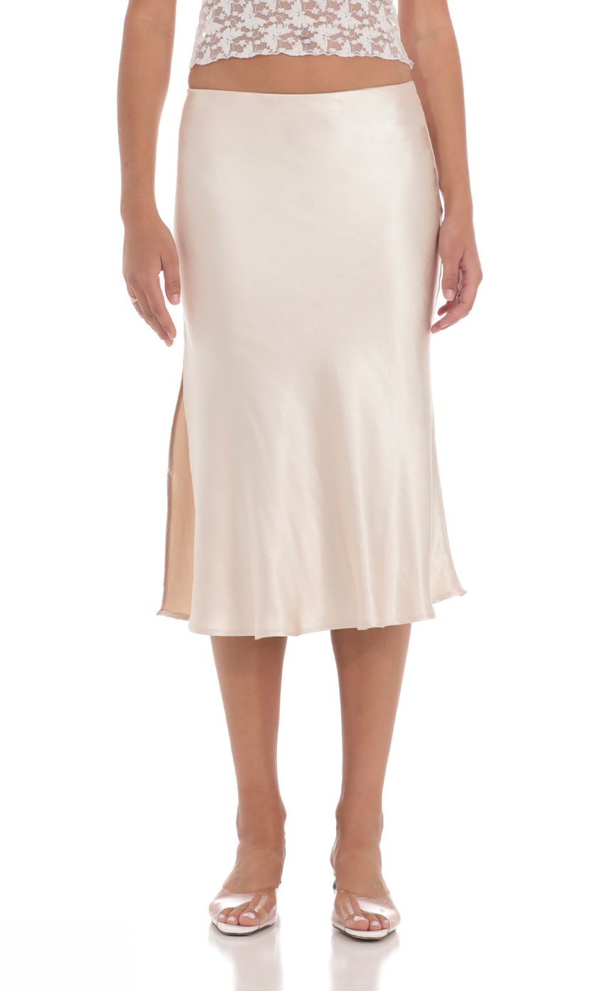 Picture Satin Midi Skirt in Cream. Source: https://media-img.lucyinthesky.com/data/May24/850xAUTO/c1fba64f-6fac-43fa-a92e-2928b6aecdc5.jpg