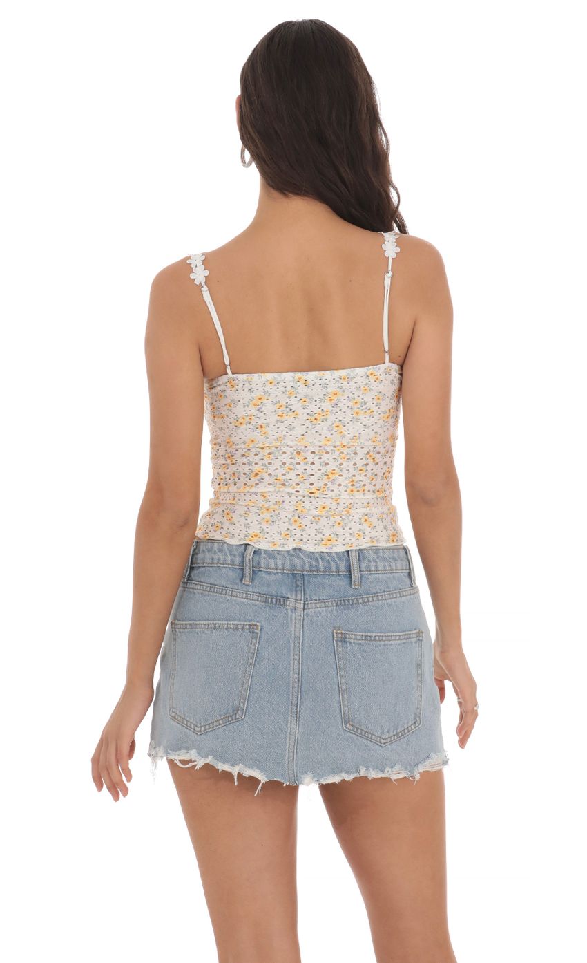 Picture Floral Strap Eyelet Top in White and Yellow. Source: https://media-img.lucyinthesky.com/data/May24/850xAUTO/c3adf62a-f983-46a1-abd7-7c7955438e01.jpg