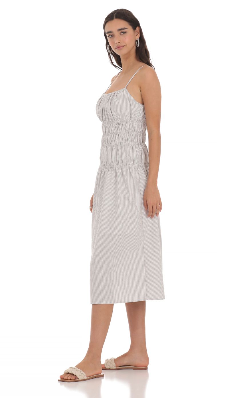 Picture Ruched Striped Midi Dress in Grey. Source: https://media-img.lucyinthesky.com/data/May24/850xAUTO/cc1628e6-c92f-4d49-869c-52bb0b256654.jpg