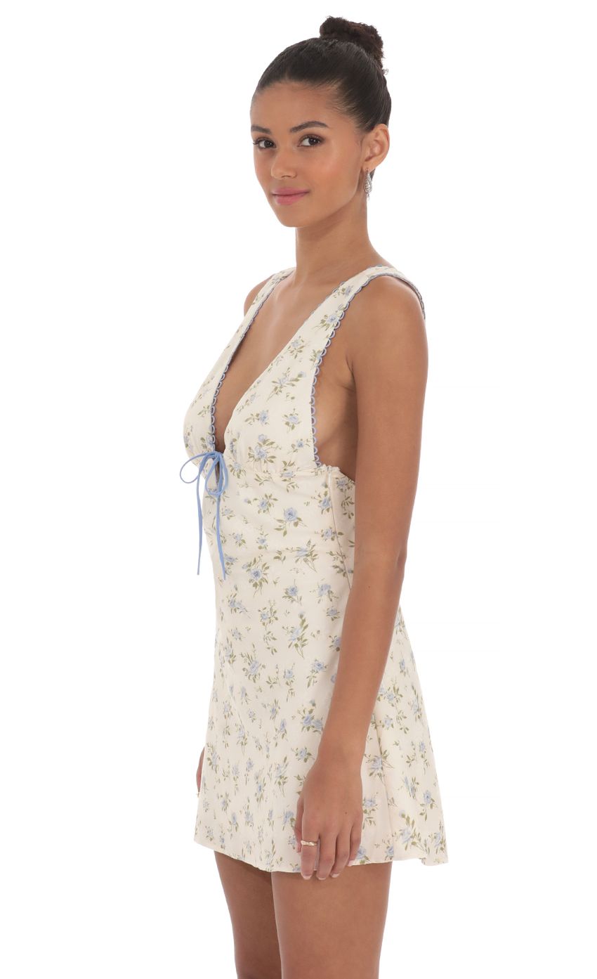 Picture Floral Plunge Neck Dress in Cream. Source: https://media-img.lucyinthesky.com/data/May24/850xAUTO/d1756dd6-9248-4f0b-bc00-1ee04f9dc282.jpg