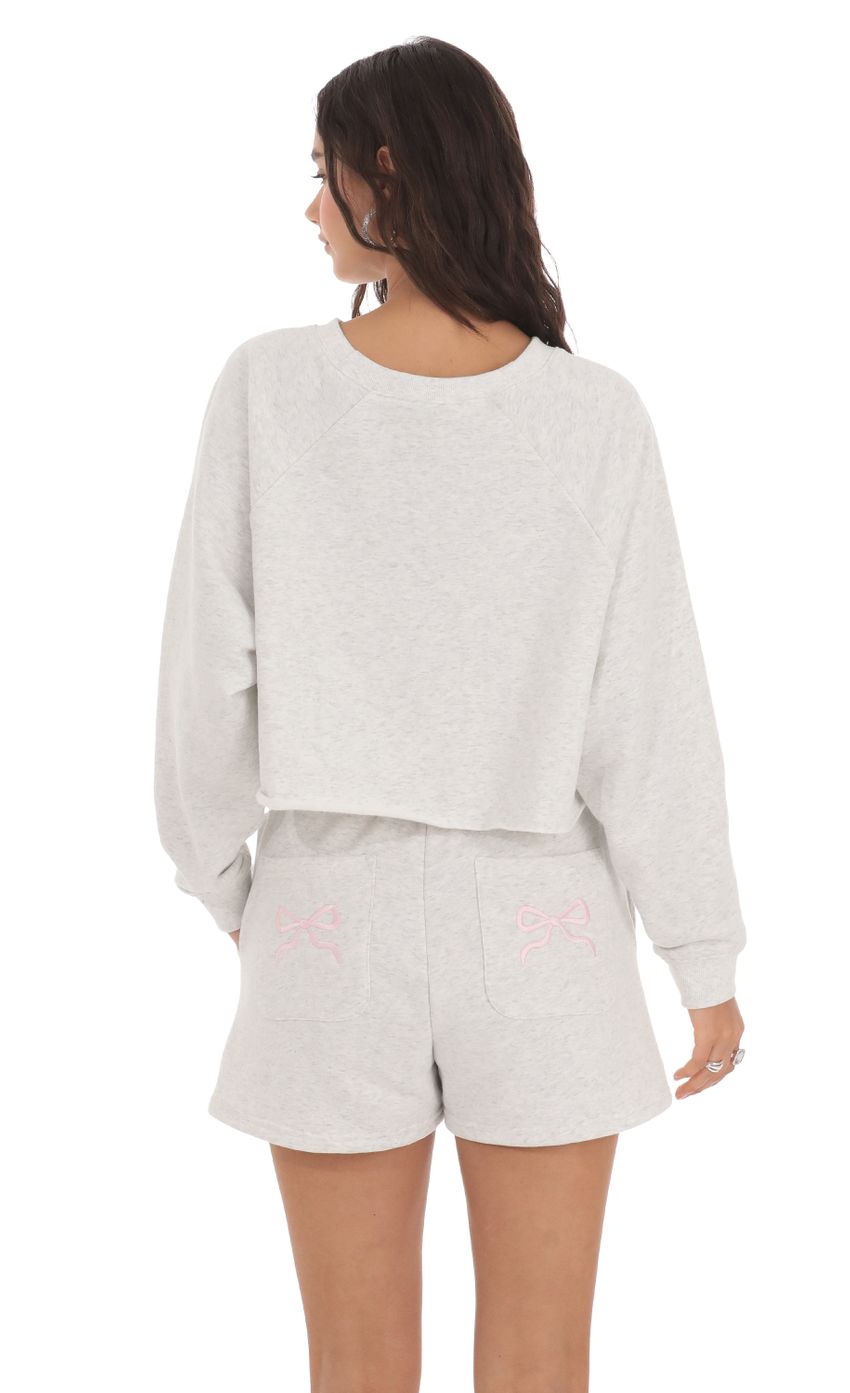 Picture Bows Back Pocket Bows Sweat Shorts in Heather Grey. Source: https://media-img.lucyinthesky.com/data/May24/850xAUTO/e179b973-ec56-4087-b1f7-2262ffc13b8b.jpg