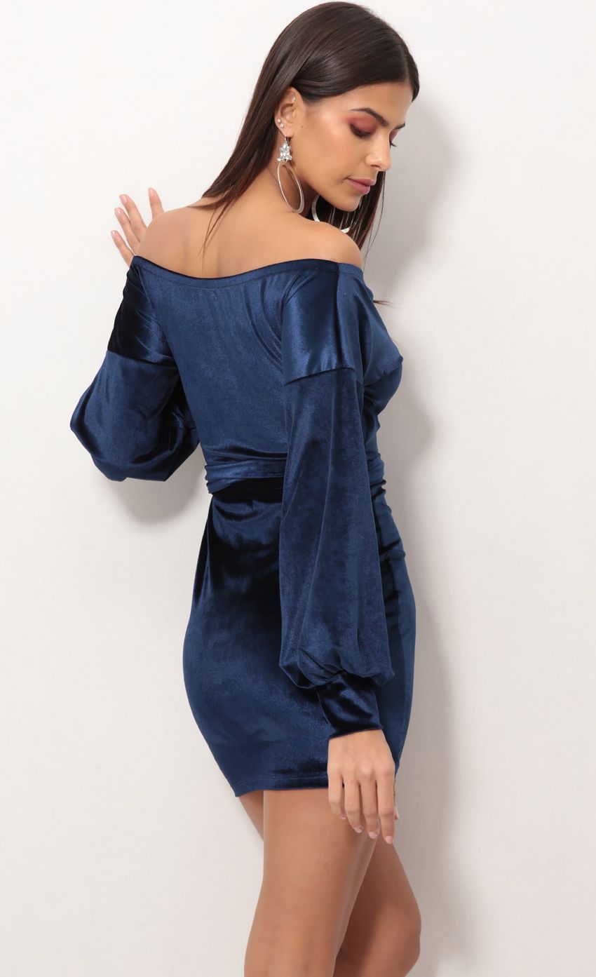 Picture Off The Shoulder Velvet Dress in Navy. Source: https://media-img.lucyinthesky.com/data/Nov18_1/850xAUTO/0Y5A8610.JPG