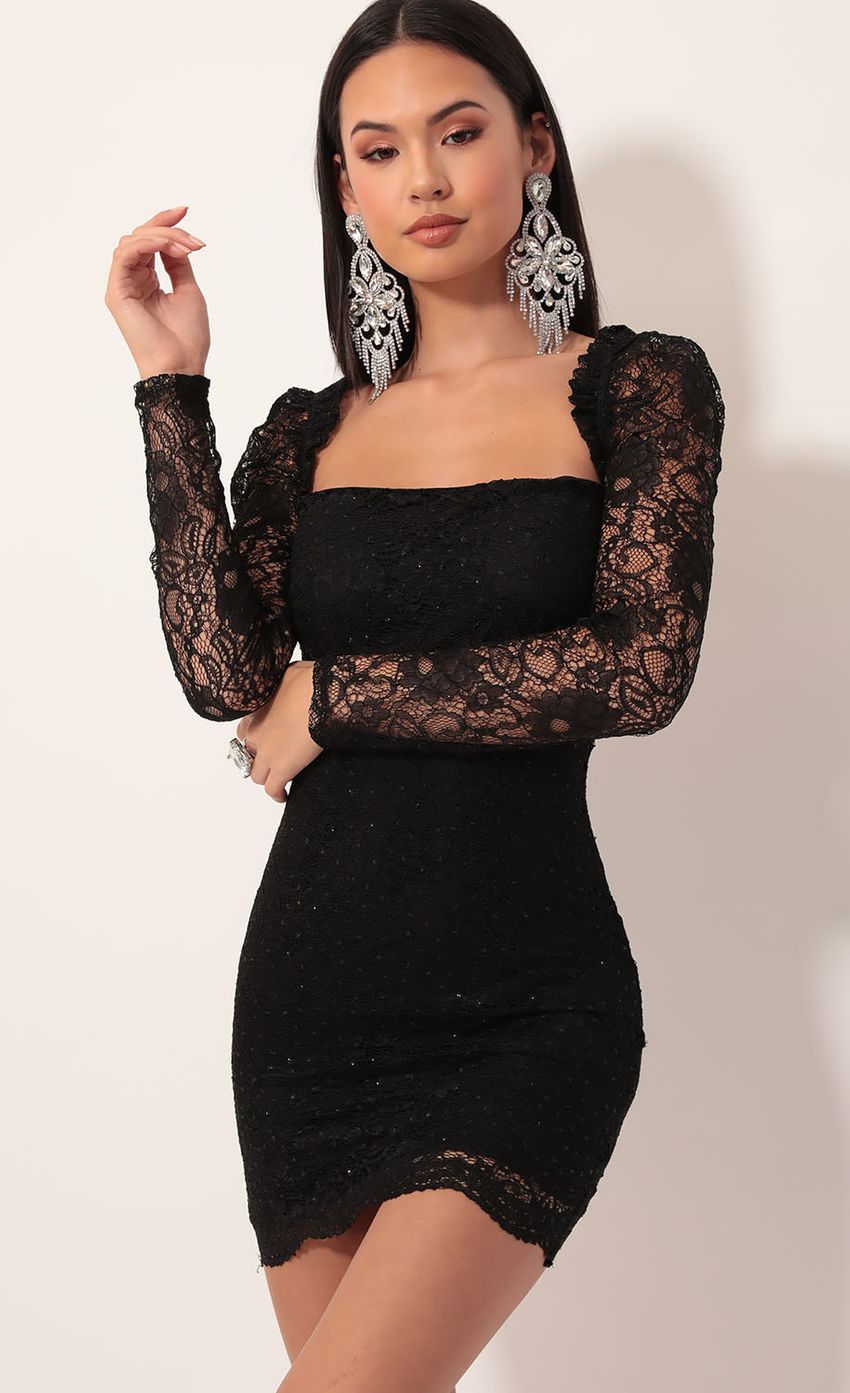 Picture Elisa Puff Sleeve Lace Dress in Sparkling Black. Source: https://media-img.lucyinthesky.com/data/Nov19_2/850xAUTO/781A5940.JPG