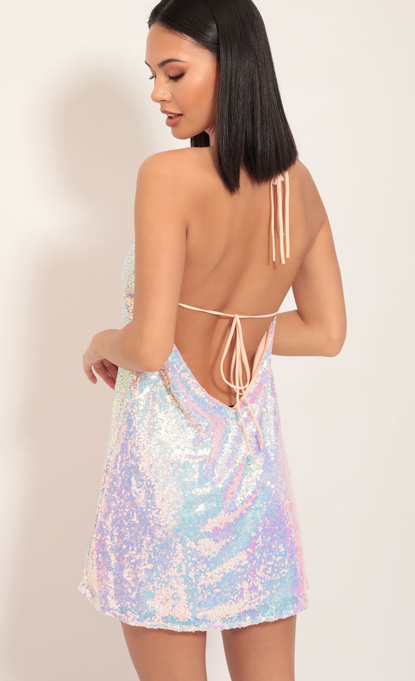 Picture Maya Sequin Halter Dress in Pink Iridescence. Source: https://media-img.lucyinthesky.com/data/Nov19_2/850xAUTO/781A6181S.JPG