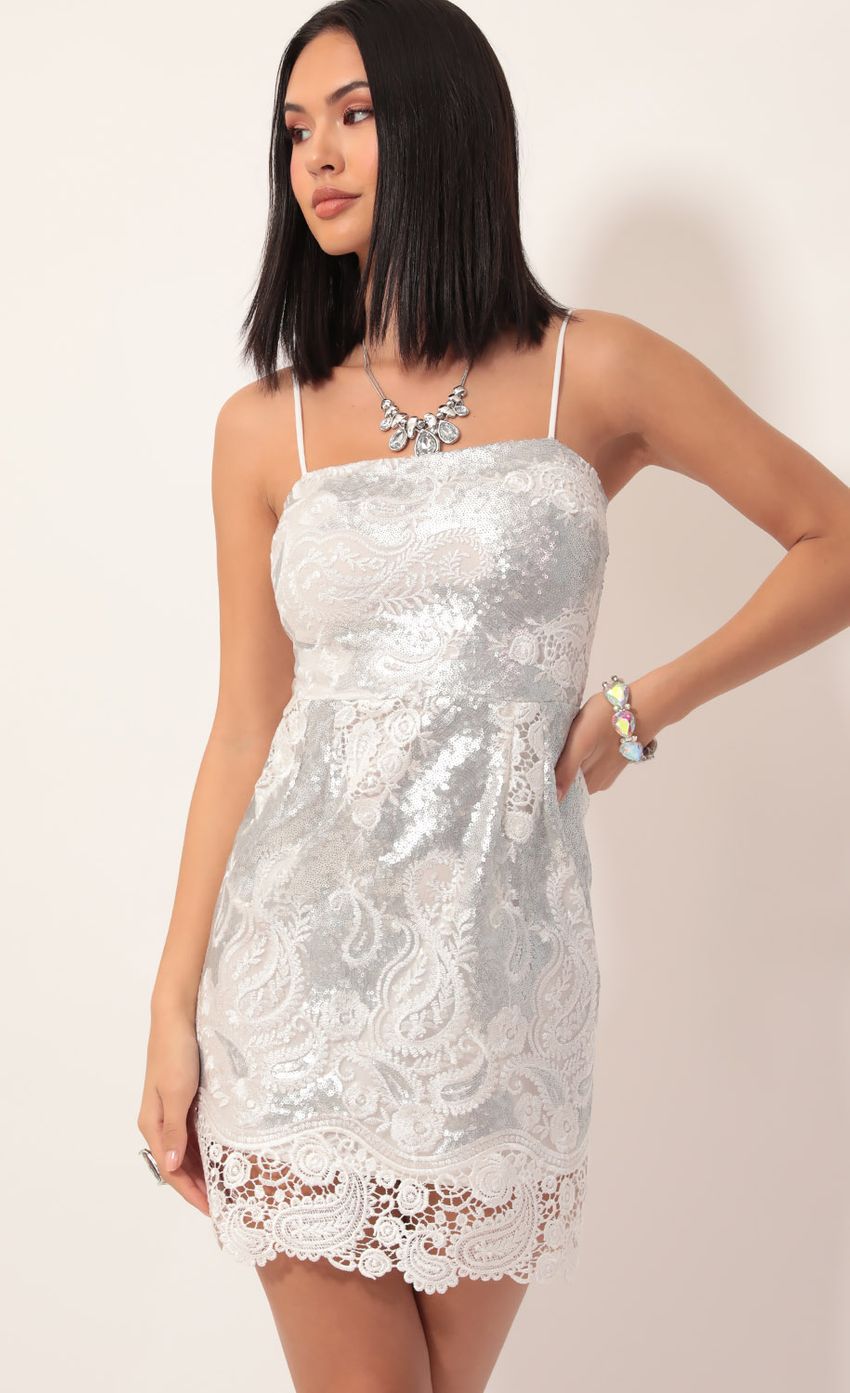 Picture Moira Sequin Lace Dress in White Silver. Source: https://media-img.lucyinthesky.com/data/Nov19_2/850xAUTO/781A6872.JPG