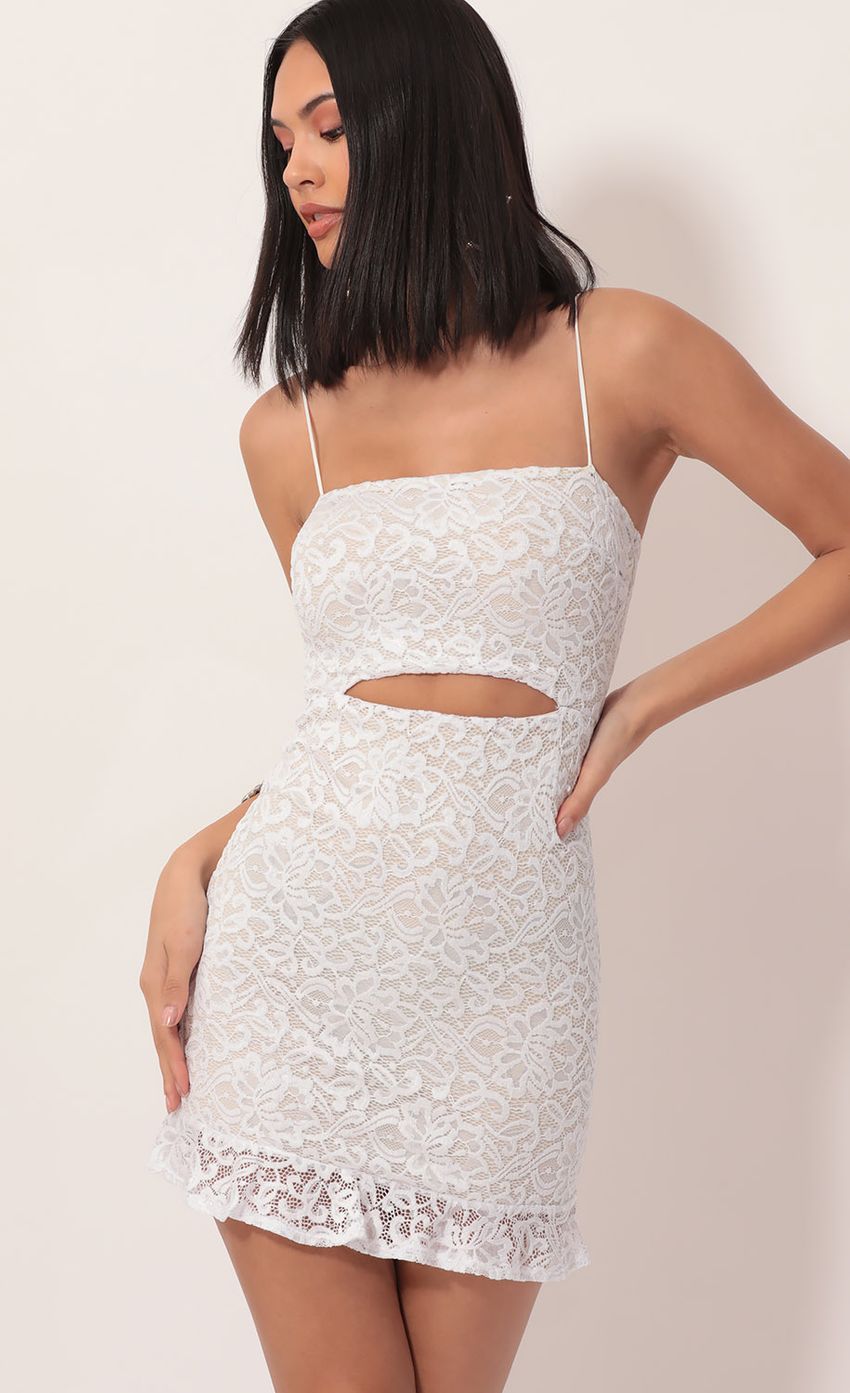 Picture Lace Cutout Ruffle Dress in White. Source: https://media-img.lucyinthesky.com/data/Nov19_2/850xAUTO/781A8604.JPG