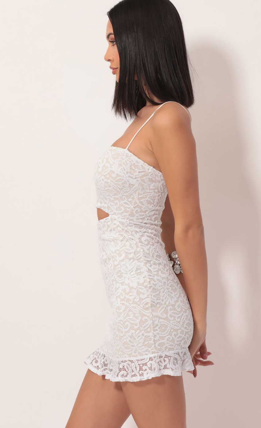 Picture Lace Cutout Ruffle Dress in White. Source: https://media-img.lucyinthesky.com/data/Nov19_2/850xAUTO/781A8609.JPG