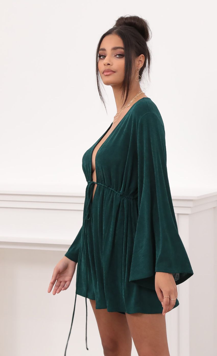 Picture Plunge Neck Bell Sleeve Romper in Emerald Green. Source: https://media-img.lucyinthesky.com/data/Nov20_2/850xAUTO/1V9A13501.JPG