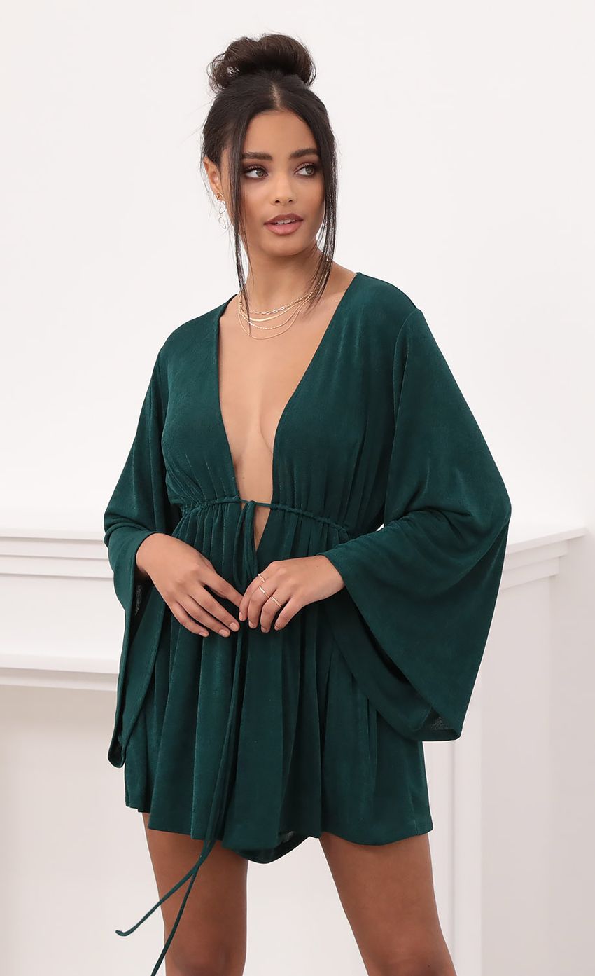 Picture Plunge Neck Bell Sleeve Romper in Emerald Green. Source: https://media-img.lucyinthesky.com/data/Nov20_2/850xAUTO/1V9A1365.JPG