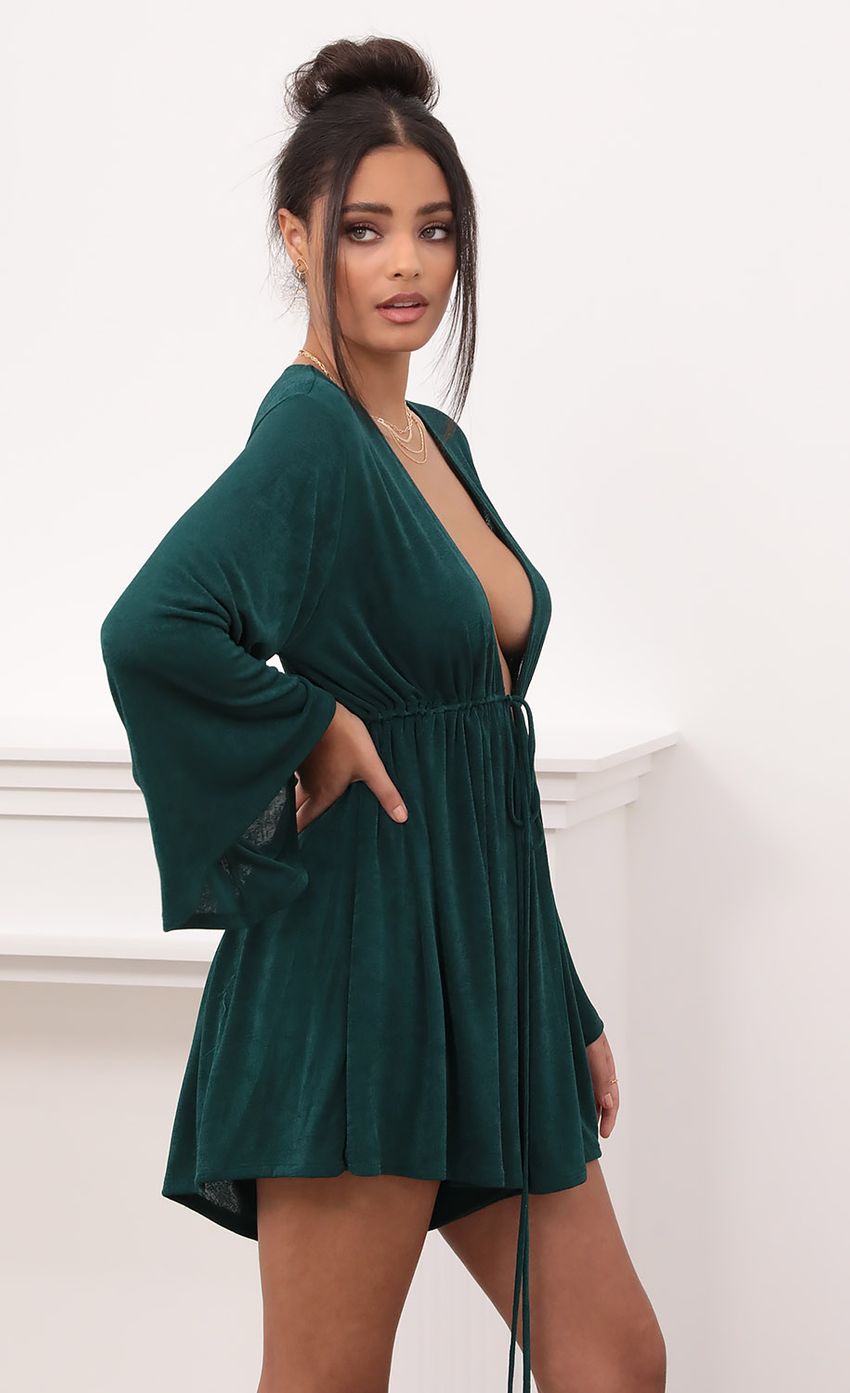 Picture Plunge Neck Bell Sleeve Romper in Emerald Green. Source: https://media-img.lucyinthesky.com/data/Nov20_2/850xAUTO/1V9A1378.JPG