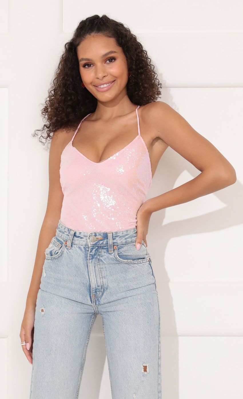 Picture Party Sequin Bodysuit in Baby Pink. Source: https://media-img.lucyinthesky.com/data/Nov21_1/850xAUTO/1V9A1005.JPG
