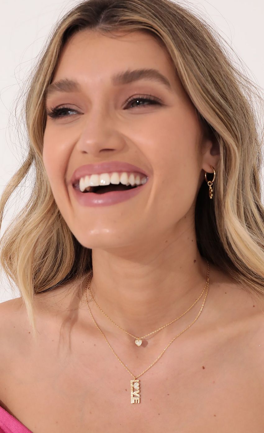 Picture Love Me Layered Necklace in Gold. Source: https://media-img.lucyinthesky.com/data/Nov21_1/850xAUTO/2V9A1521.JPG