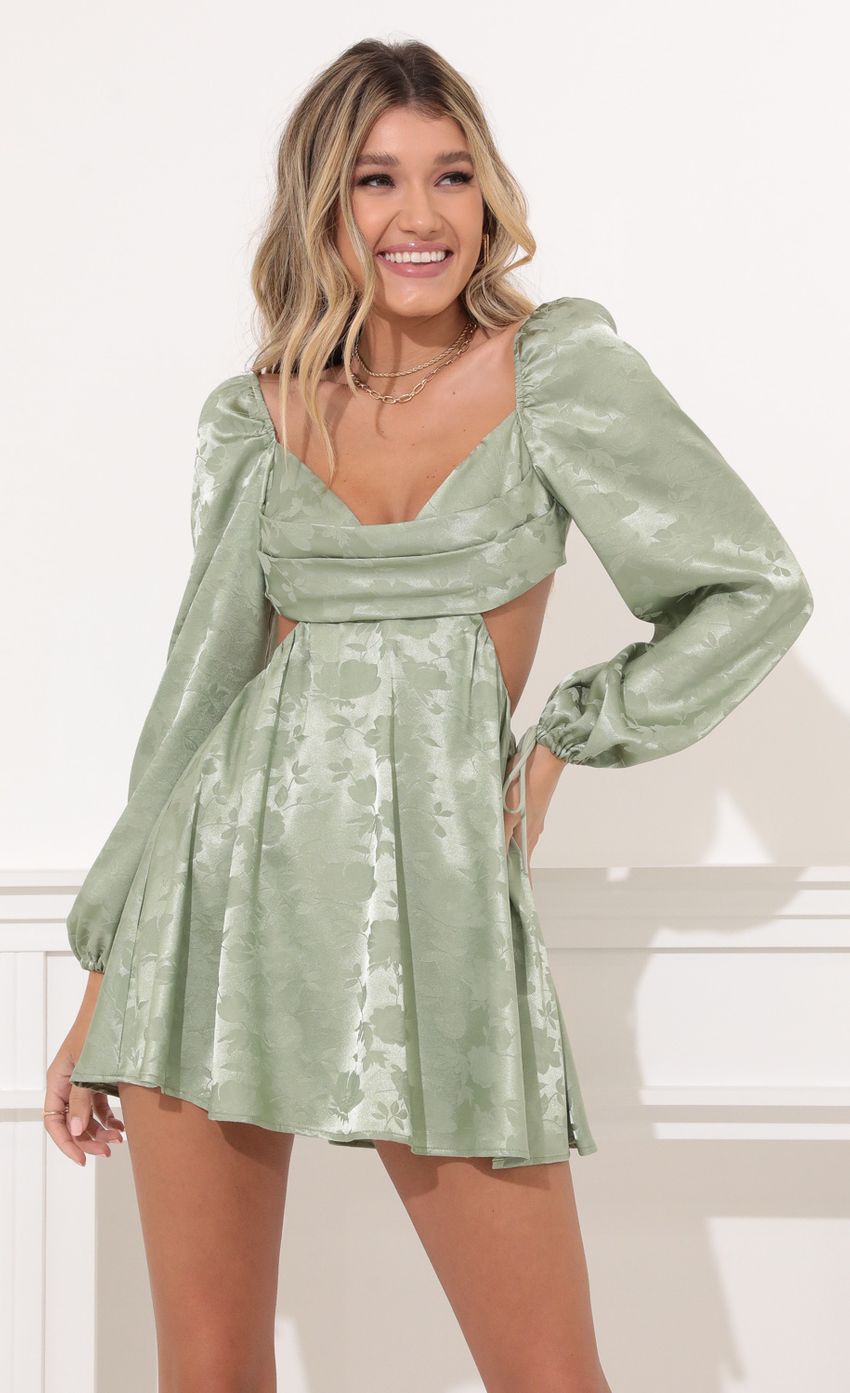 Picture Long Sleeve Fit and Flare Dress in Green Floral Satin. Source: https://media-img.lucyinthesky.com/data/Nov21_2/850xAUTO/1V9A0062.JPG