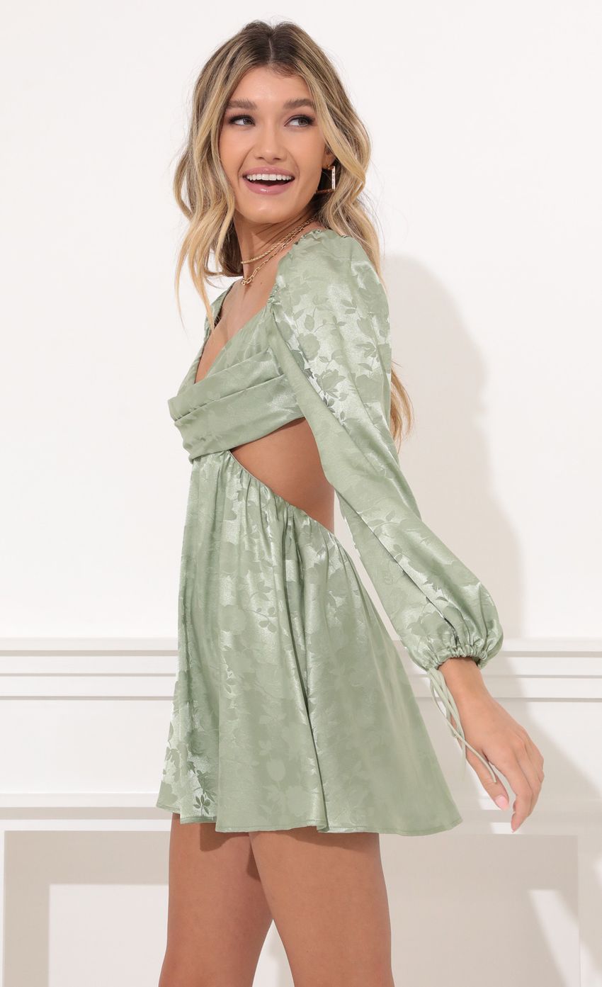 Picture Long Sleeve Fit and Flare Dress in Green Floral Satin. Source: https://media-img.lucyinthesky.com/data/Nov21_2/850xAUTO/1V9A0089.JPG