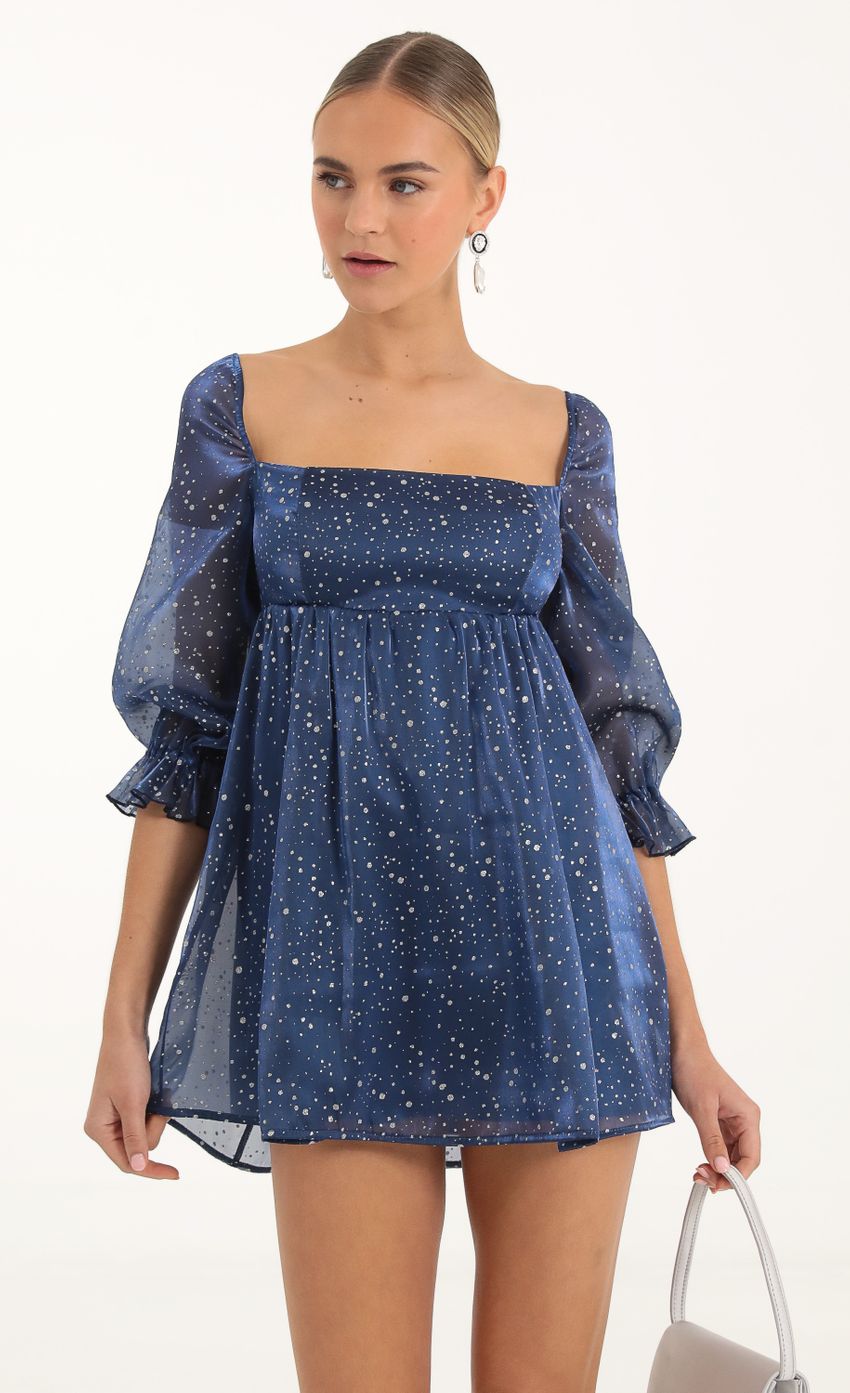 Picture Glitter Puff Sleeve Baby Doll Dress in Blue. Source: https://media-img.lucyinthesky.com/data/Nov22/850xAUTO/34dd6849-4d15-456b-8c29-1c2270cd90bc.jpg