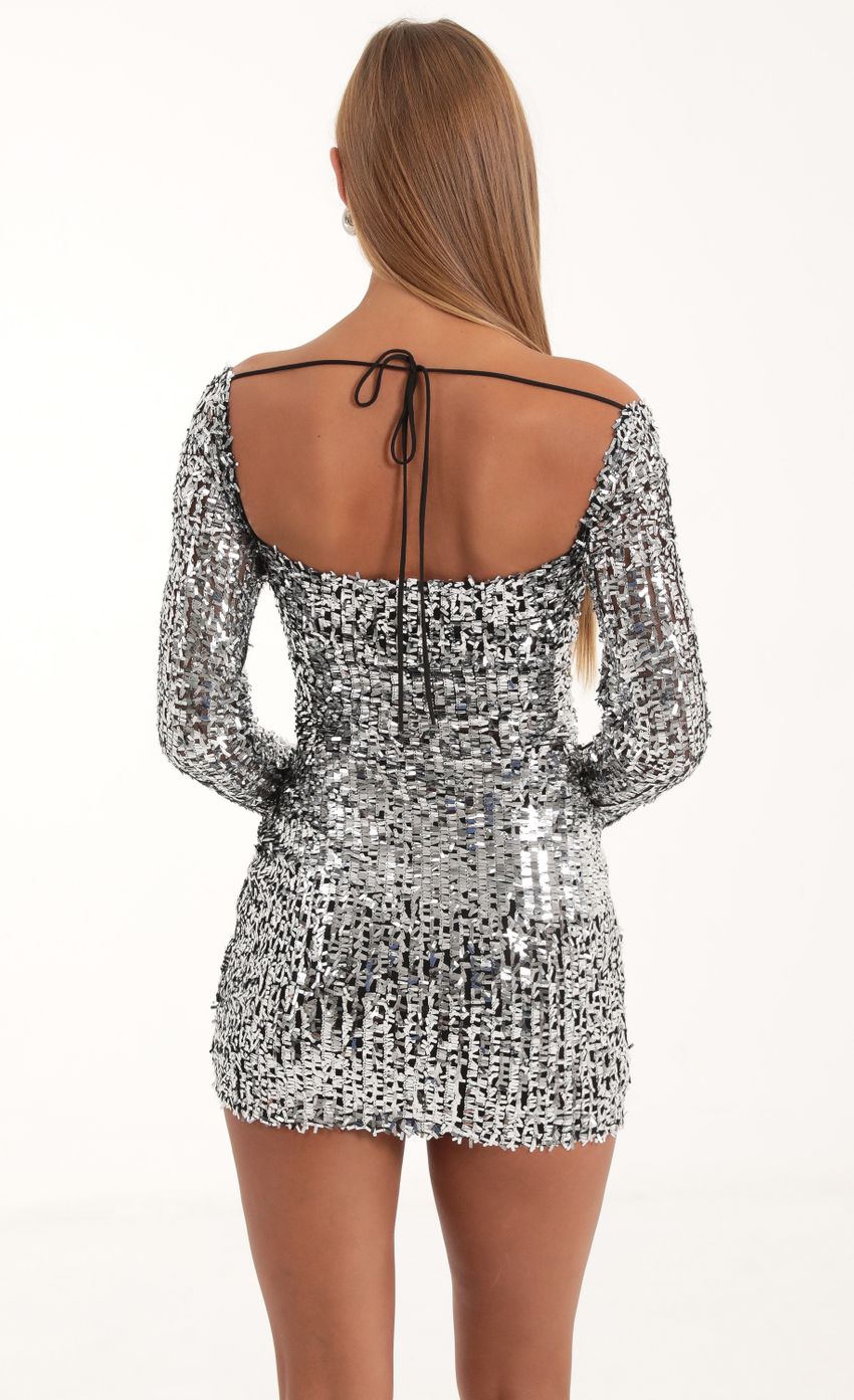 Picture Sequin Mesh Long Sleeve Dress in Silver. Source: https://media-img.lucyinthesky.com/data/Nov22/850xAUTO/3a44774a-1a6a-4ba9-911f-85c11e027912.jpg