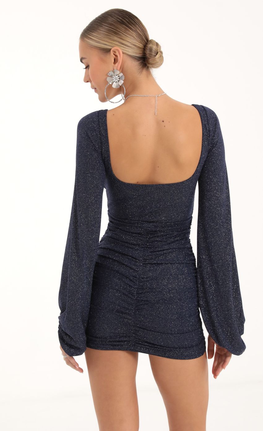 Picture Glitter Ruched Long Sleeve Dress in Navy. Source: https://media-img.lucyinthesky.com/data/Nov22/850xAUTO/4851b1c0-a06b-4477-ae75-6d70e6e1cb21.jpg