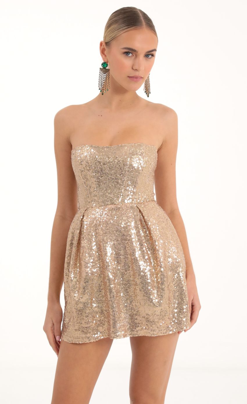 Picture Sequin Corset Dress in Gold. Source: https://media-img.lucyinthesky.com/data/Nov22/850xAUTO/62f00193-0d8f-4221-b922-b11e38c7963d.jpg