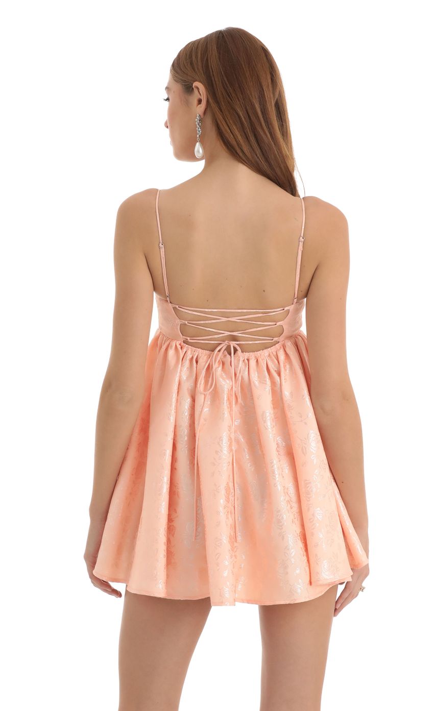 Picture Floral Jacquard Babydoll Dress in Peach. Source: https://media-img.lucyinthesky.com/data/Nov22/850xAUTO/8aa799be-6409-4d65-b2d6-36bba46c5c59.jpg