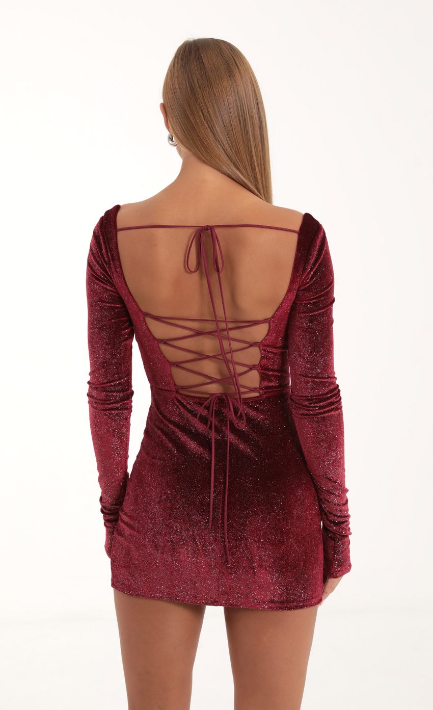 Picture Velvet Glitter Long Sleeve Corset Dress in Red. Source: https://media-img.lucyinthesky.com/data/Nov22/850xAUTO/91e1d648-c404-4591-942e-a833a43bac44.jpg