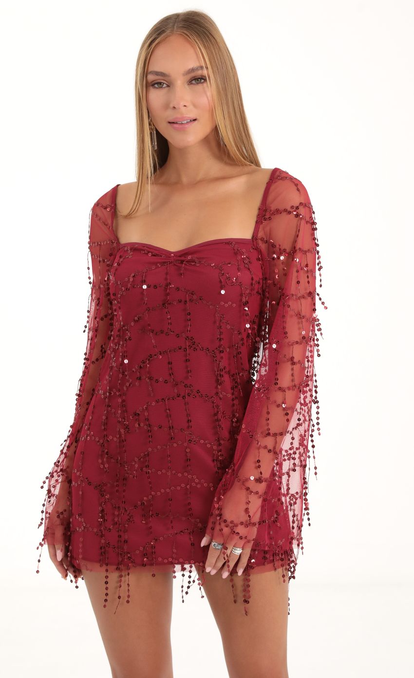 Picture Wynnie Fringe Sequin Flare Sleeve Dress in Red. Source: https://media-img.lucyinthesky.com/data/Nov22/850xAUTO/a3e966ea-681f-4f9b-a038-bbda38fef1b3.jpg
