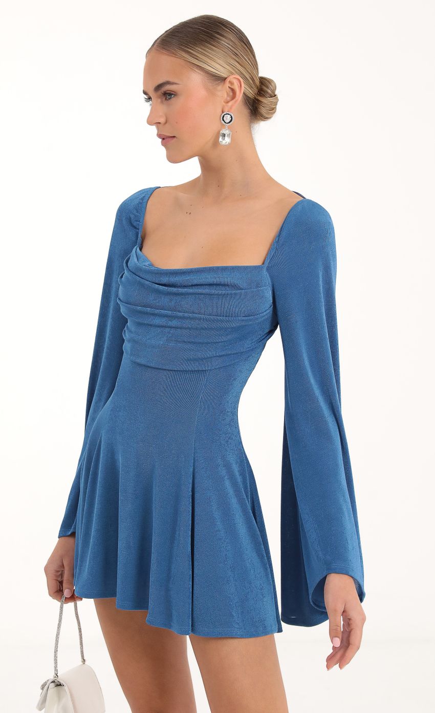 Picture Flare Sleeve Dress in Blue. Source: https://media-img.lucyinthesky.com/data/Nov22/850xAUTO/b2763d0f-2254-45a9-b0d3-3b789a1886fb.jpg