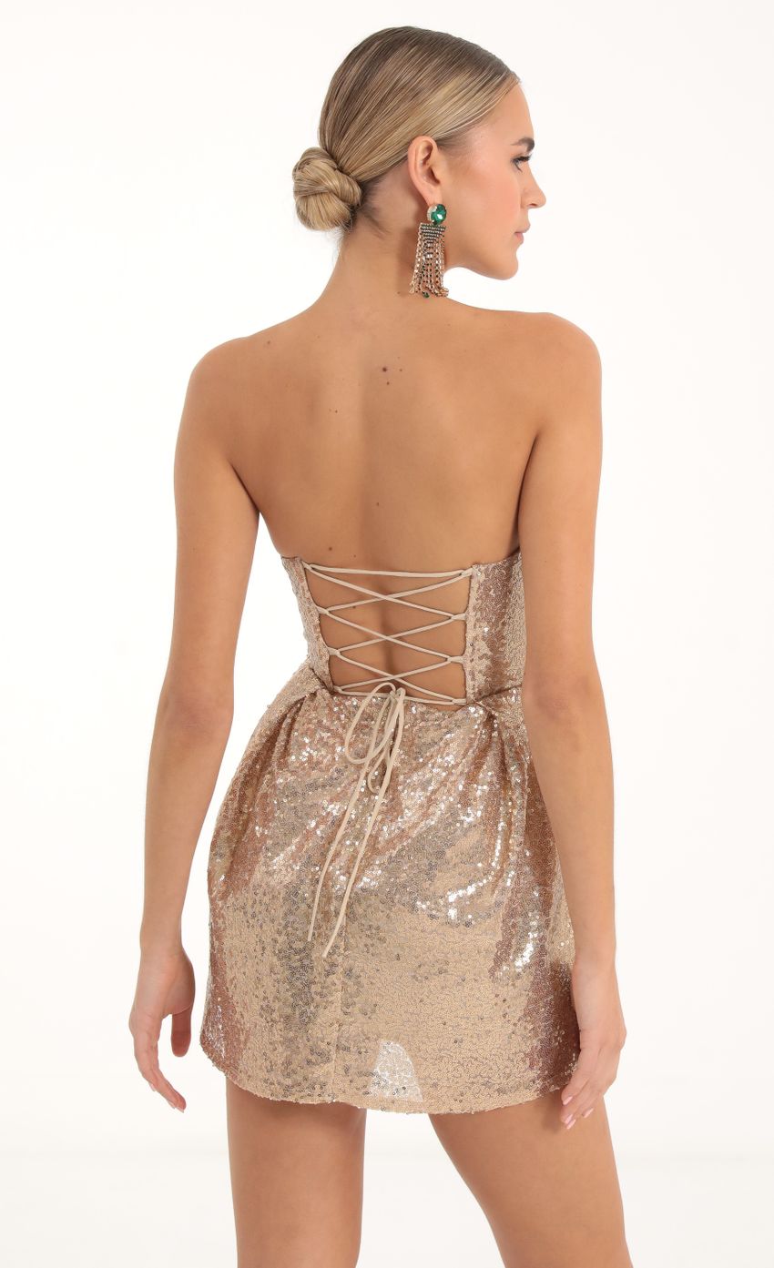 Picture Sequin Corset Dress in Gold. Source: https://media-img.lucyinthesky.com/data/Nov22/850xAUTO/c1fd7a2c-c89c-4741-8d99-927027871a6d.jpg
