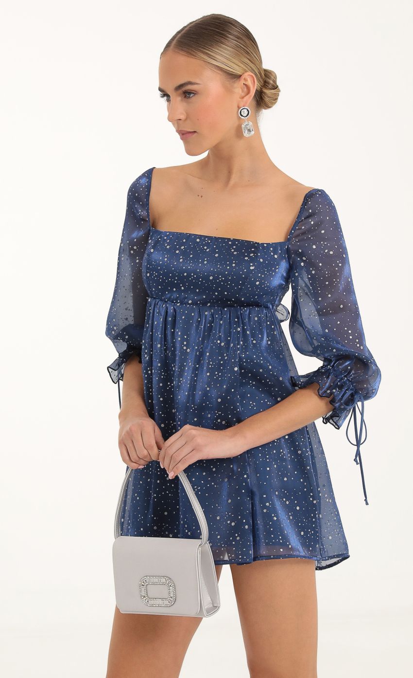 Picture Glitter Puff Sleeve Baby Doll Dress in Blue. Source: https://media-img.lucyinthesky.com/data/Nov22/850xAUTO/d867bd37-3a26-499d-bf5f-ee8cec6c5b3f.jpg