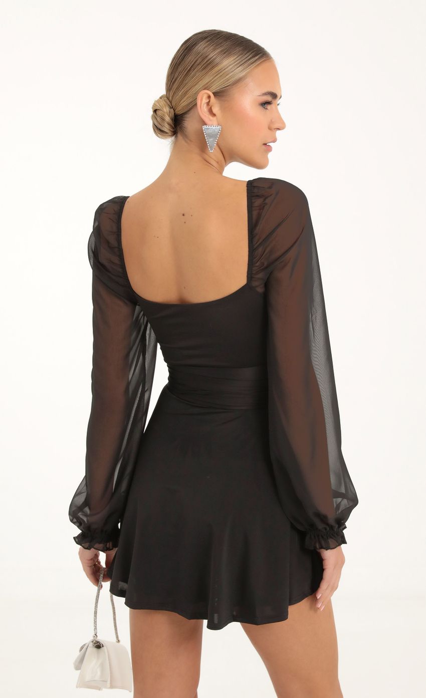 Picture Puff Chiffon Wrap Dress in Black. Source: https://media-img.lucyinthesky.com/data/Nov22_1/850xAUTO/1V9A2425.JPG