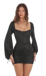Picture Shimmer Long Sleeve Corset Dress in Black. Source: https://media-img.lucyinthesky.com/data/Nov23/150xAUTO/c7aaa280-d115-4945-980e-261913dedd85.jpg