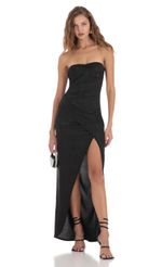 Picture Overlap Shimmer Strapless Dress in Black. Source: https://media-img.lucyinthesky.com/data/Nov23/150xAUTO/f48a0dc3-b1a4-4291-a3a3-5119cb981bb5.jpg