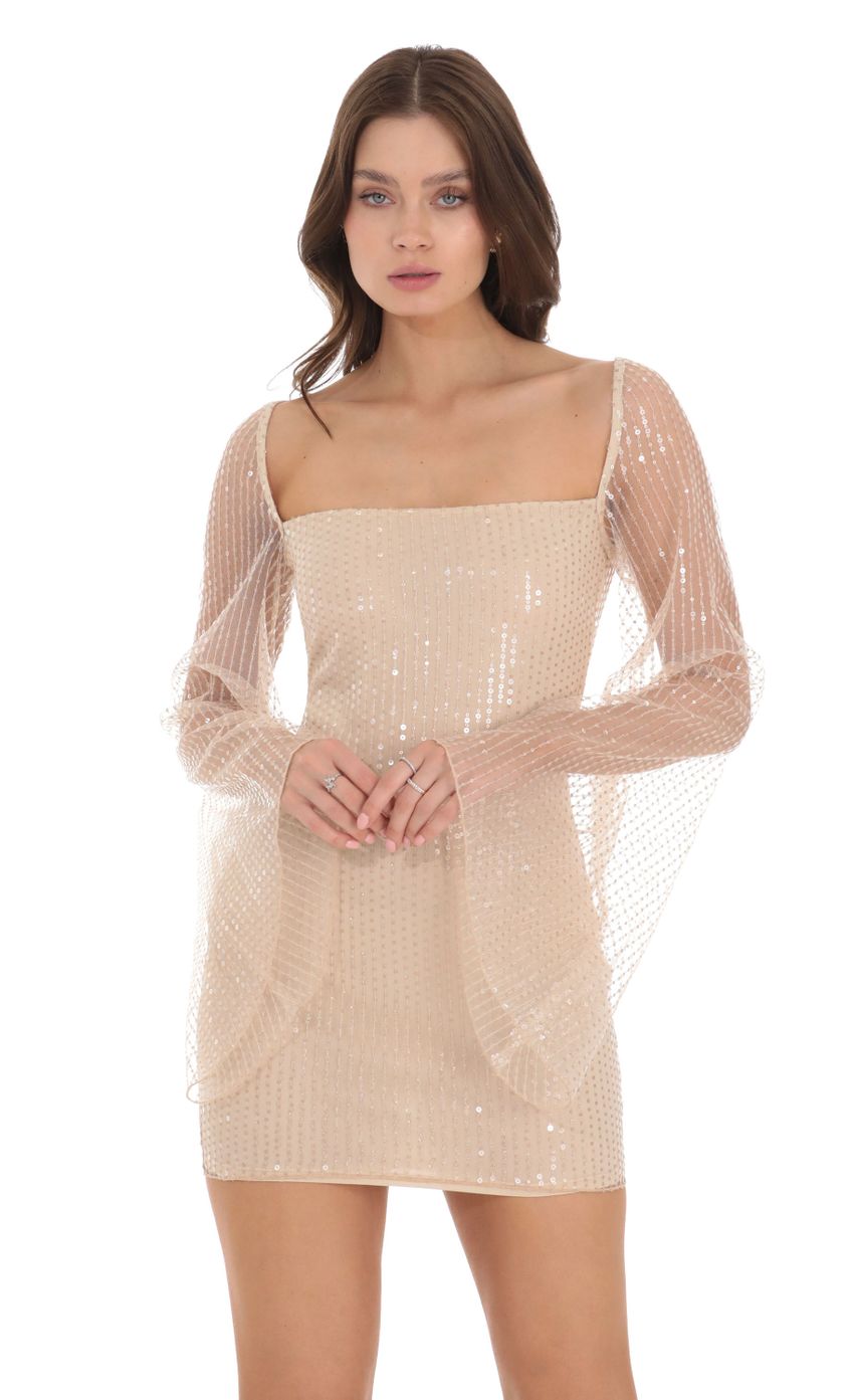Picture Tulle Sequin Flare Sleeve Dress in Champagne. Source: https://media-img.lucyinthesky.com/data/Nov23/850xAUTO/0d48559c-6d0f-4797-be34-dc334fcb226b.jpg