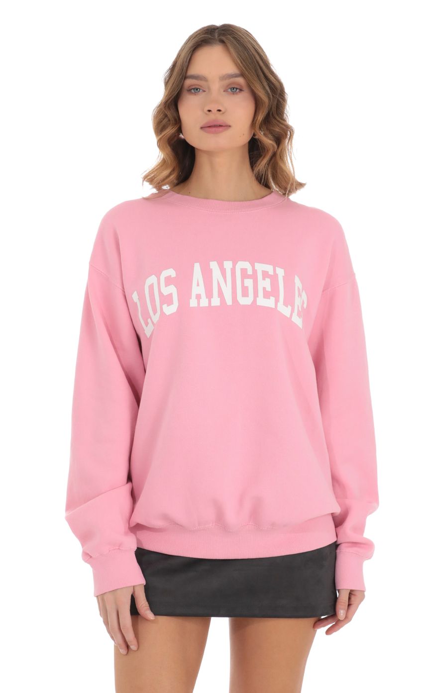 Picture Los Angeles Crewneck in Pink. Source: https://media-img.lucyinthesky.com/data/Nov23/850xAUTO/1a1c499b-fd1f-4182-becd-f02f489e1422.jpg