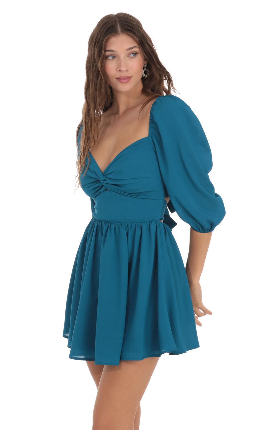 Picture Puff Sleeve Twist Dress in Blue. Source: https://media-img.lucyinthesky.com/data/Nov23/850xAUTO/1d983bde-abd1-4f59-a886-008978383447.jpg