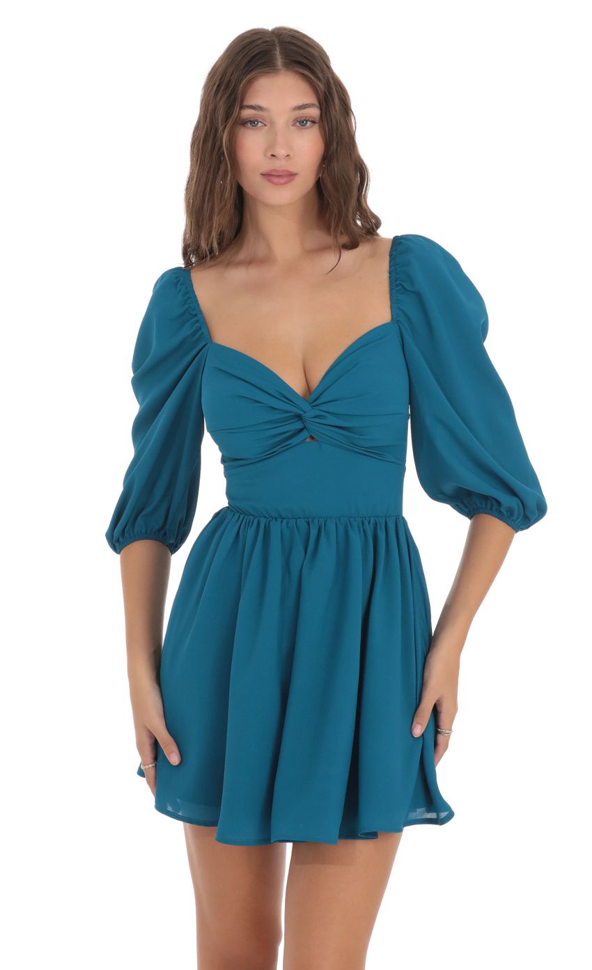 Picture Puff Sleeve Twist Dress in Blue. Source: https://media-img.lucyinthesky.com/data/Nov23/850xAUTO/2f0be209-228c-48ce-a9f6-d7bfbb578f84.jpg