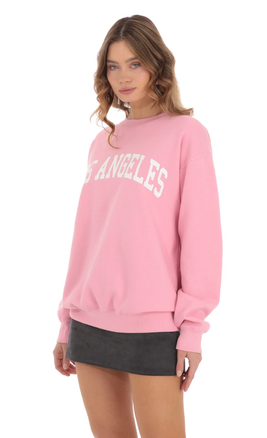 Picture Los Angeles Crewneck in Pink. Source: https://media-img.lucyinthesky.com/data/Nov23/850xAUTO/3fe0e41a-6874-46d2-8f4b-6ce83736a511.jpg