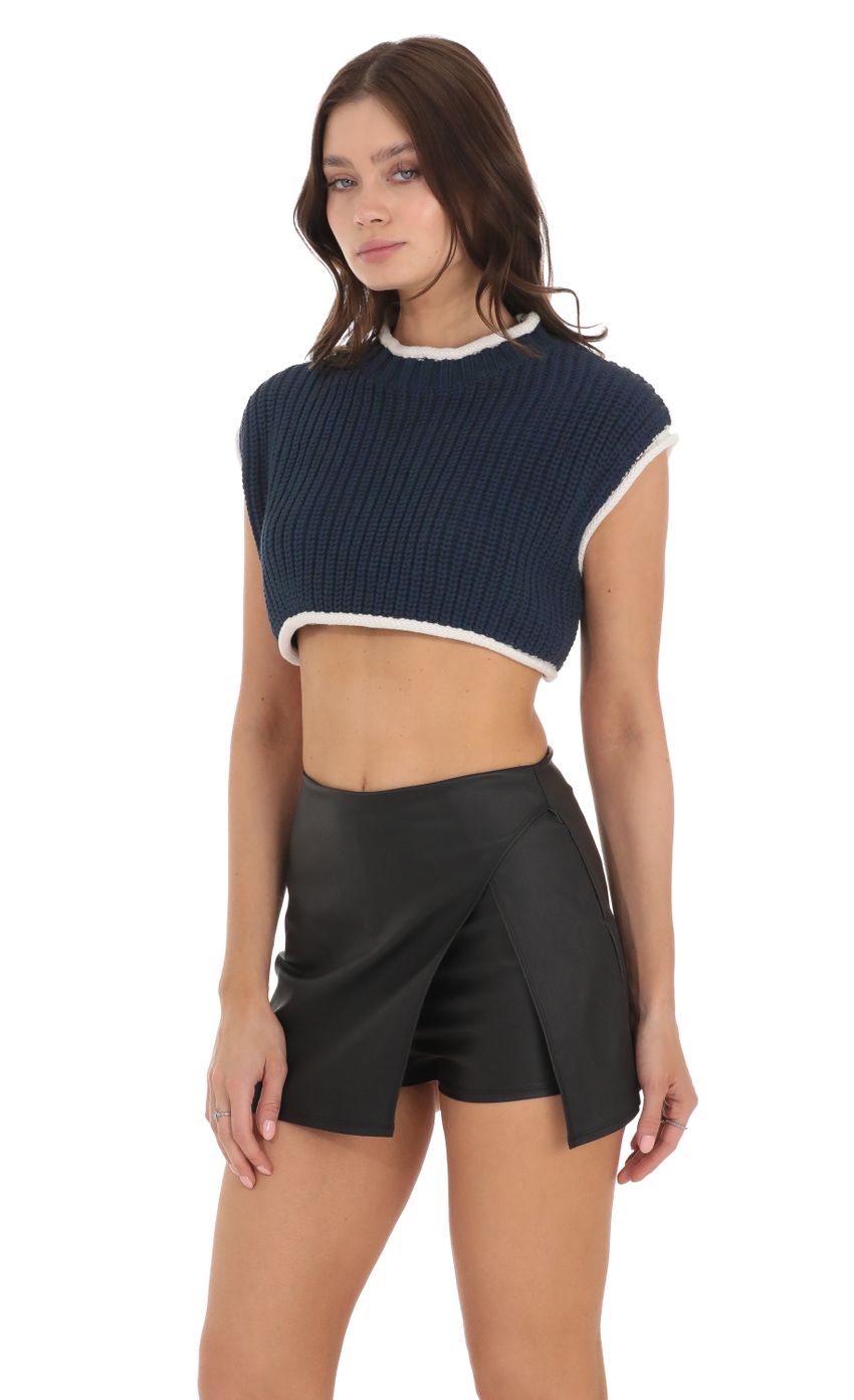 Picture Knit Open Back Cropped Top in Navy. Source: https://media-img.lucyinthesky.com/data/Nov23/850xAUTO/6e8c05f9-79c7-46a9-9d5e-07949f630472.jpg