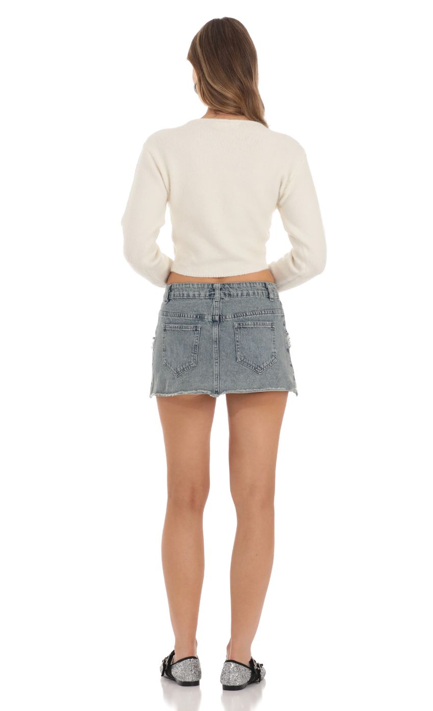Picture Bedazzled Jean Skirt in Blue Denim. Source: https://media-img.lucyinthesky.com/data/Nov23/850xAUTO/716d174e-3ac6-4f21-9d15-b2cceb75dab3.jpg