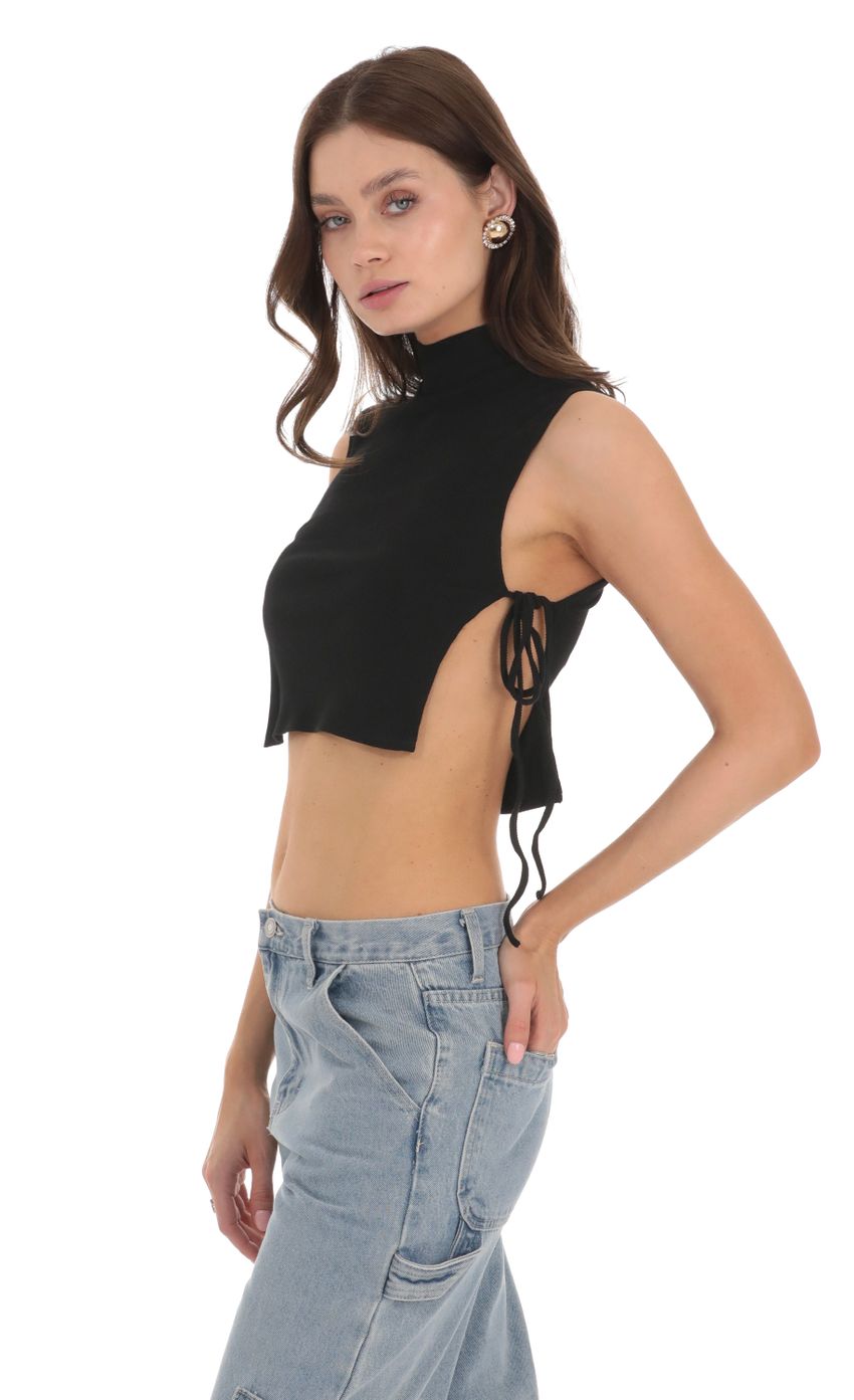 Picture Ribbed Mock Neck Top in Black. Source: https://media-img.lucyinthesky.com/data/Nov23/850xAUTO/7243670e-a2fb-40cc-8050-0438d84b5e7a.jpg