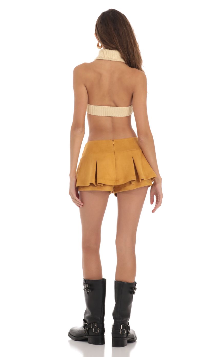 Picture Pleated Mini Skort in Mustard. Source: https://media-img.lucyinthesky.com/data/Nov23/850xAUTO/838aa7ea-a36f-4a7d-bf9b-f8e944ab3516.jpg