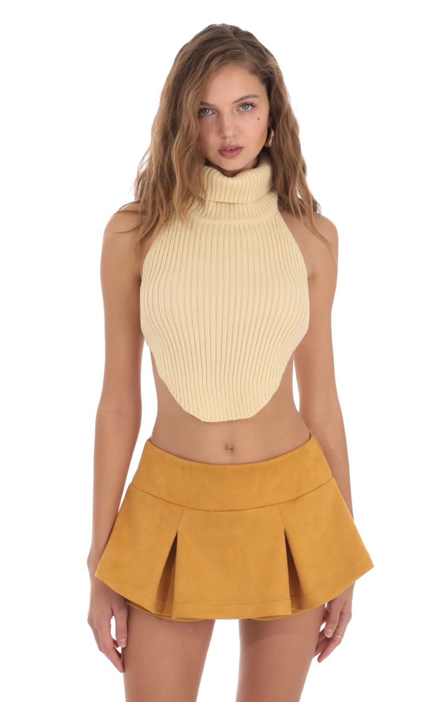 Picture Turtleneck Knit Open Back Top in Cream. Source: https://media-img.lucyinthesky.com/data/Nov23/850xAUTO/c93ba555-90a1-4822-8e80-4bab77ae7dc7.jpg