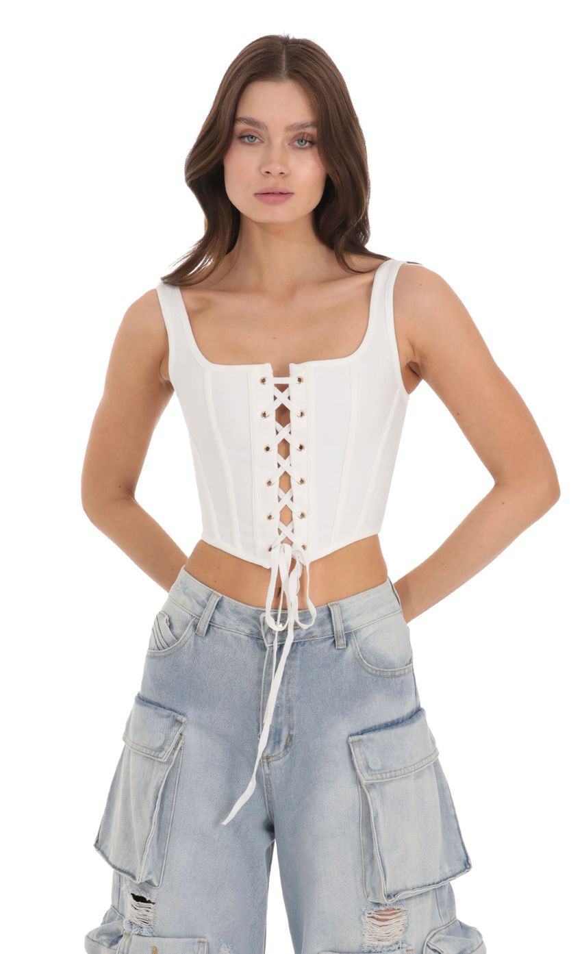 Picture Lace-Up Corset Top in White. Source: https://media-img.lucyinthesky.com/data/Nov23/850xAUTO/f1731f08-ffe2-4766-a7a3-c8678c01c75e.jpg