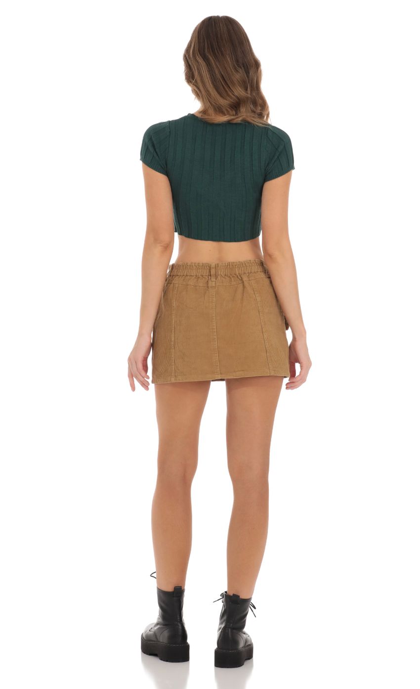 Picture Knit Cutout Top in Green. Source: https://media-img.lucyinthesky.com/data/Nov23/850xAUTO/fc23a6f9-c619-4fcc-a3a1-0048eabbdef7.jpg