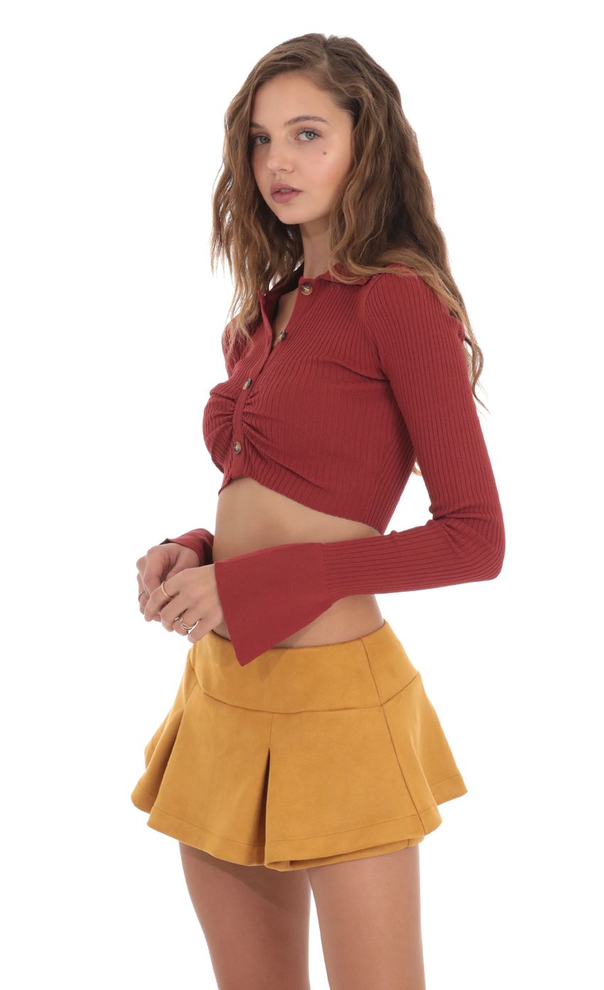 Picture Ribbed Collared Top in Maroon. Source: https://media-img.lucyinthesky.com/data/Nov23/850xAUTO/fcc72637-85ec-448a-903d-926b560c51a0.jpg