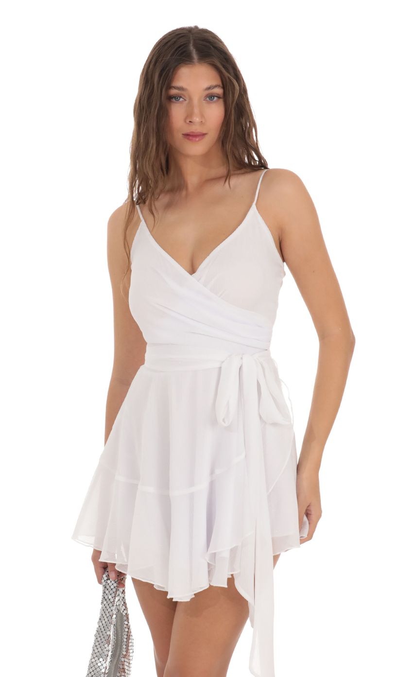 Picture Wrap Dress in White Shimmer. Source: https://media-img.lucyinthesky.com/data/Nov23/850xAUTO/fd6aafda-bc43-4b7c-b6b8-9ea5bf48f175.jpg