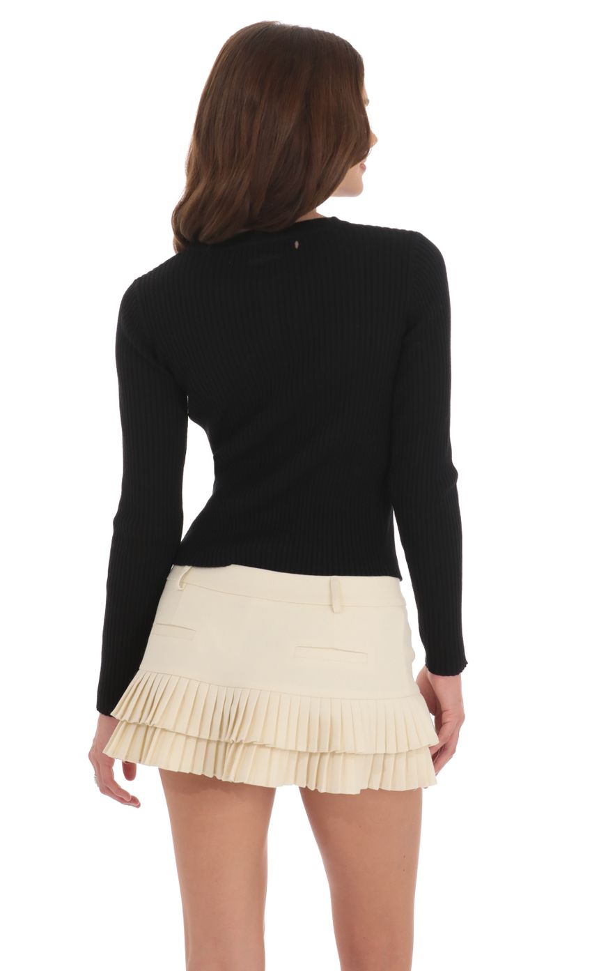 Picture Ribbed Knit Button Cardigan in Black. Source: https://media-img.lucyinthesky.com/data/Nov24/850xAUTO/c675e072-6b28-40ea-80e8-217cd5e03cd6.jpg