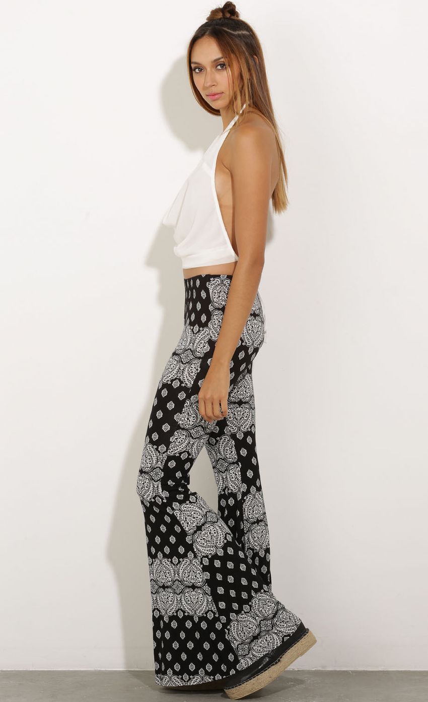 Picture Printed Bohemian Pants In Black. Source: https://media-img.lucyinthesky.com/data/Oct15_1/850xAUTO/0Y5A2416.JPG